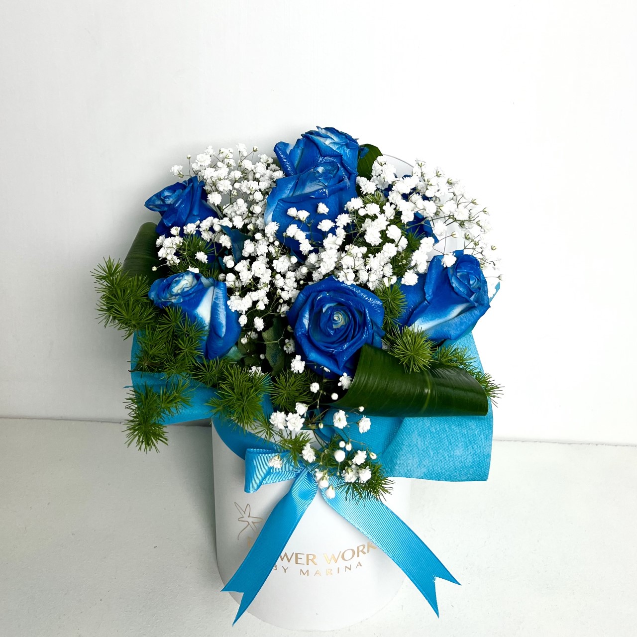 BLUE ROSES IN A WHITE BOX AND GYPSOPHILA