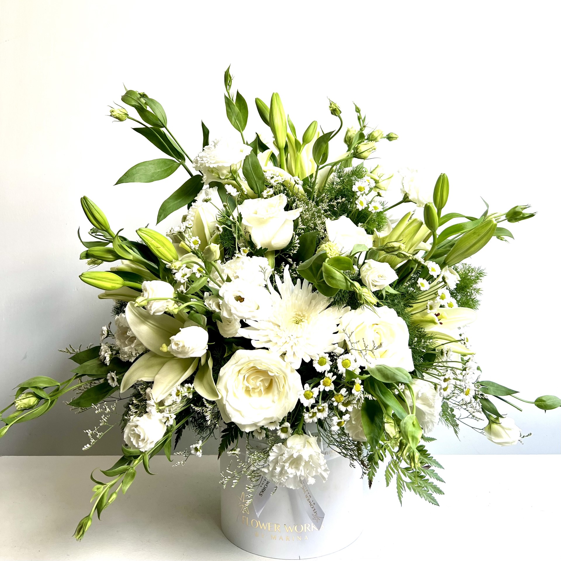 COMBINATION OF WHITE FLOWERS IN A WHITE BOX