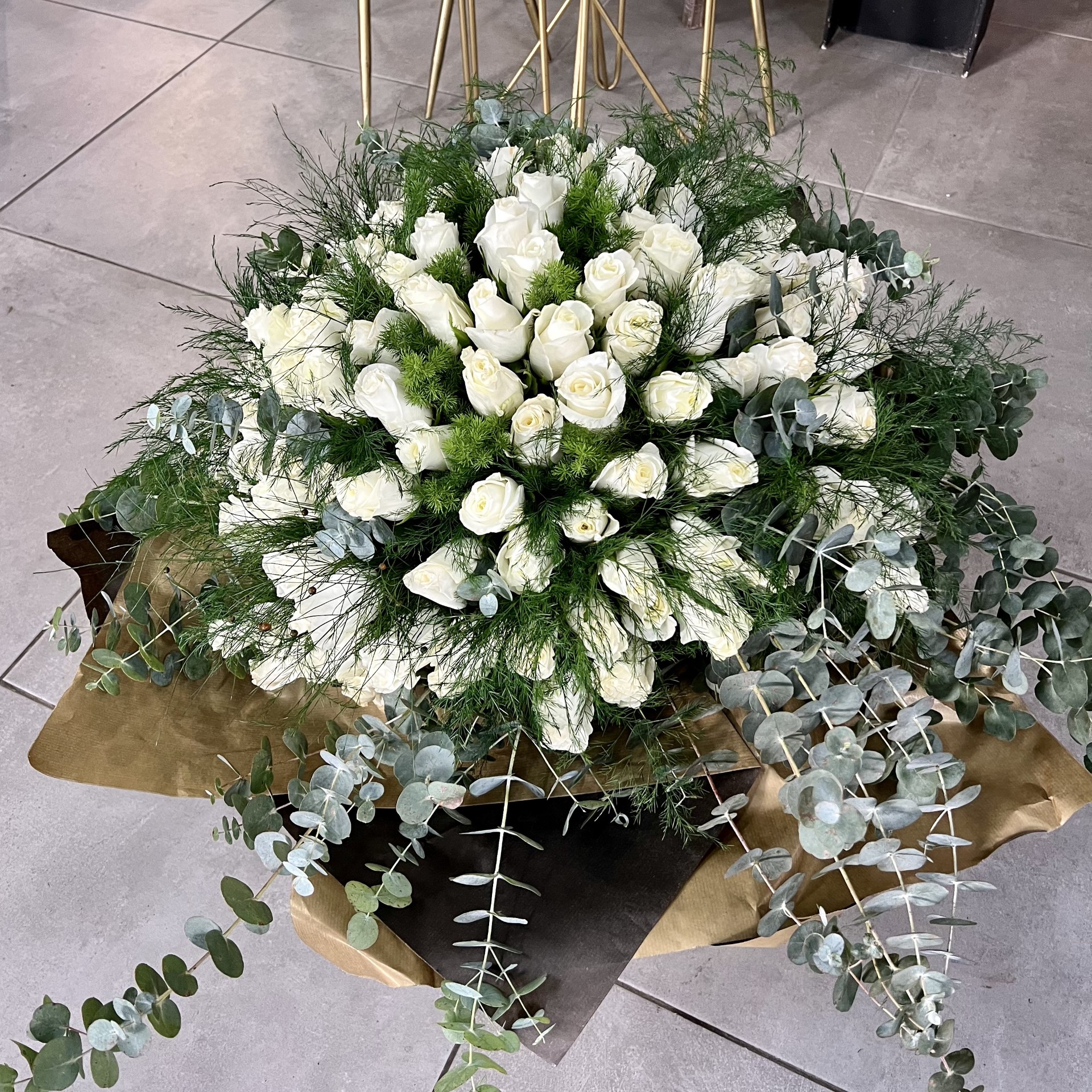 100 WHITE ROSES BOUQUET AND GREENERY